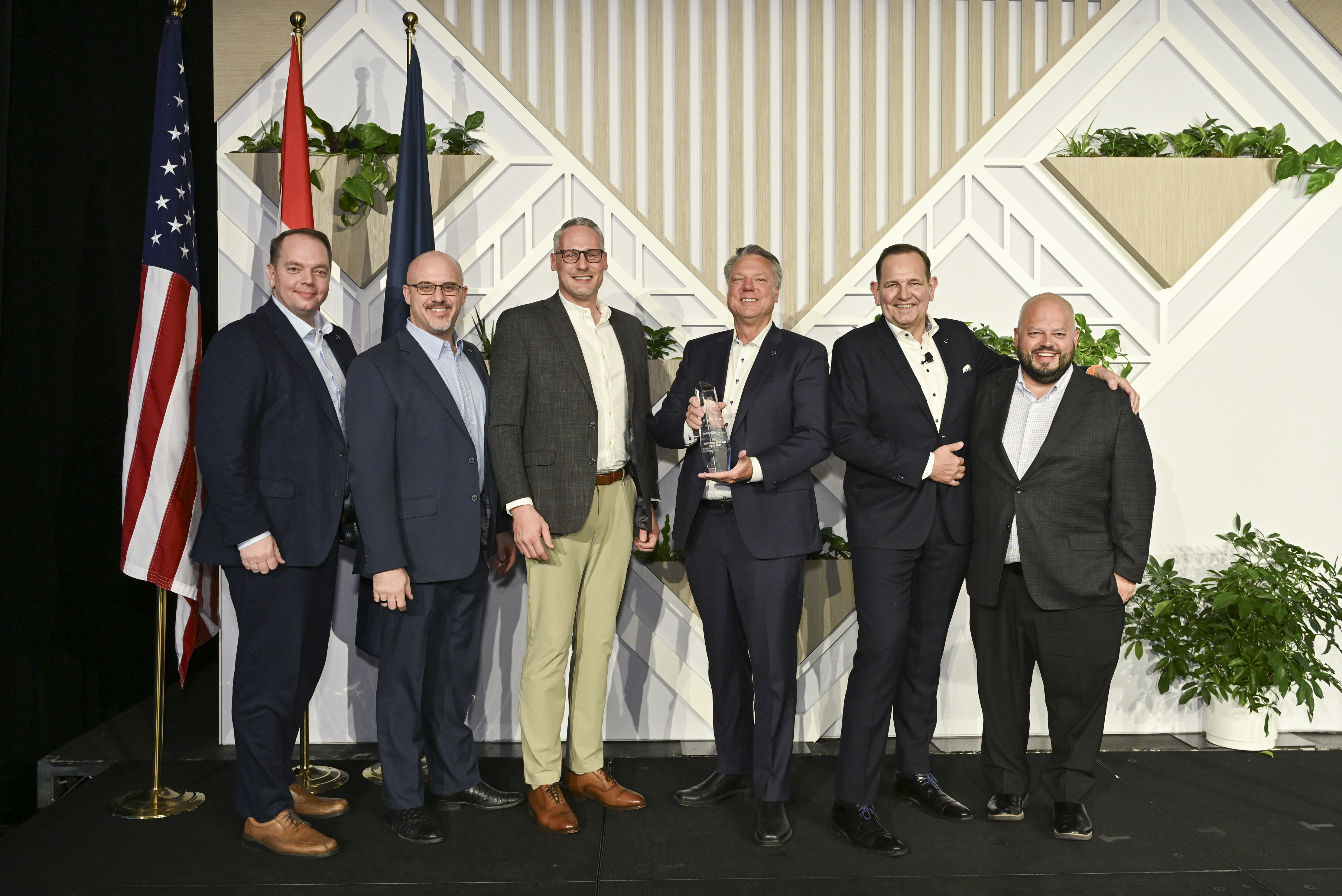 M&K Truck Centers accepts the Volvo Trucks North America 2025 U.S. Dealer Group of the Year award from Peter Voorhoeve, president of Volvo Trucks North America. Pictured L-R: Jeremy Taylor, Central Region RVP, Volvo Trucks North America; Brad Zingre, Central Region Senior District Sales Manager, Volvo Trucks North America; Josh Wolf, COO, M&K Truck Centers; Ron Meyering, CEO, M&K Truck Centers; Peter Voorhoeve, president, Volvo Trucks North America; Anthony Gargano, senior vice president of sales, M&K Truck Centers